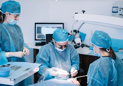 an oral surgeon performing dental implant placement