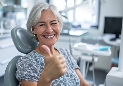 Mature dental patient making thumbs up gesture