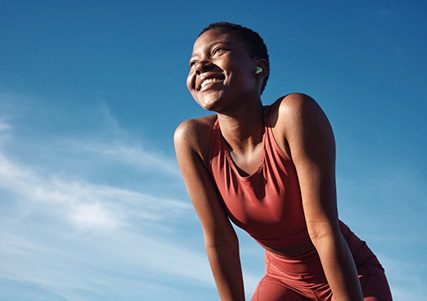 Lady smiles outdoors?