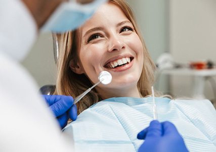 Lady smiles at dentist?